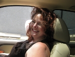 Jessica smiling in a car